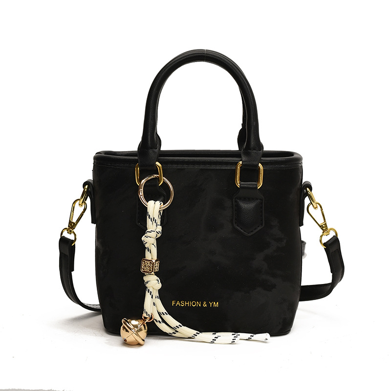 Bolso de mano popular ultra caliente para mujeres 2025 nuevo estilo versátil bolso de hombro casual simple de alto nivel nicho bolso de cubo