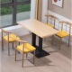 A table of four chairs log color yellow cushion