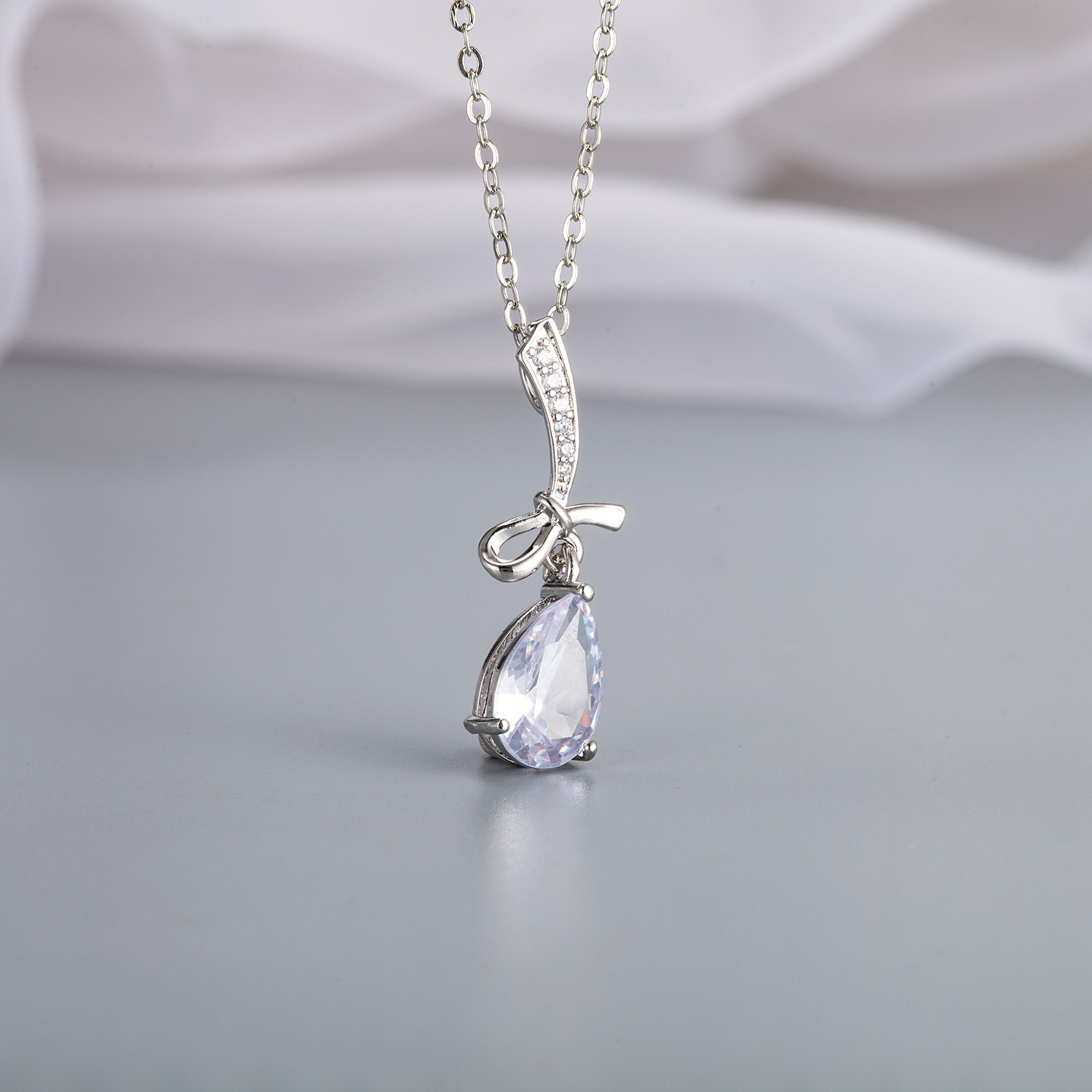 Brand pendant with zircon