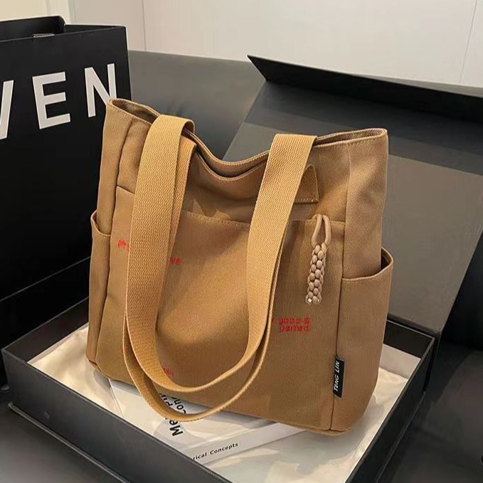 Bolsa de mano ligera para mujeres en clase de hombro único bolso de lienzo con cremallera de estilo coreano