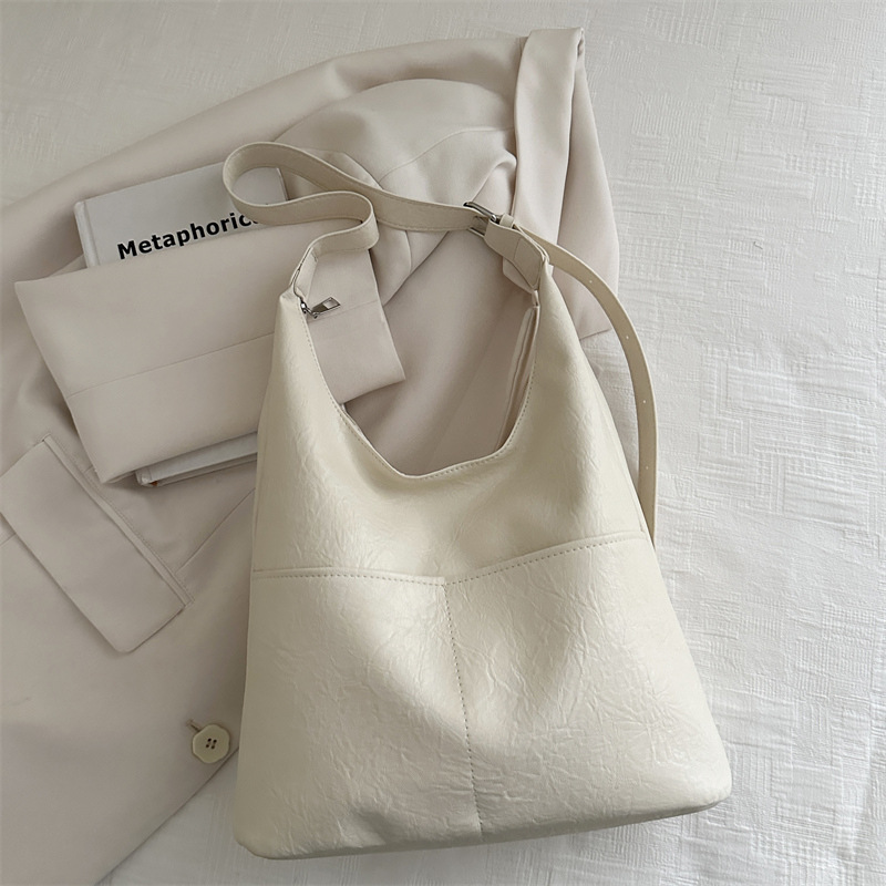 Bolso de mujer 2024, nuevo otoño y invierno de alta calidad, bolso de brazo de viaje simple, bolso de hombro de gran capacidad para mujeres.