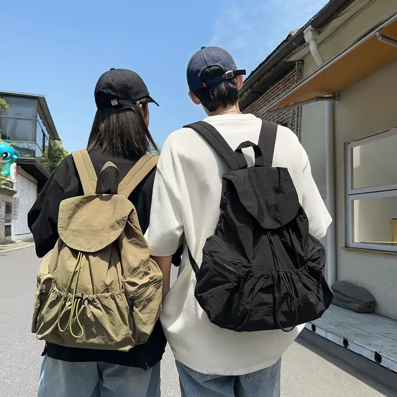 轻薄双肩包大容量抽绳设计小众休闲旅行背包轻便男女中大学生书包