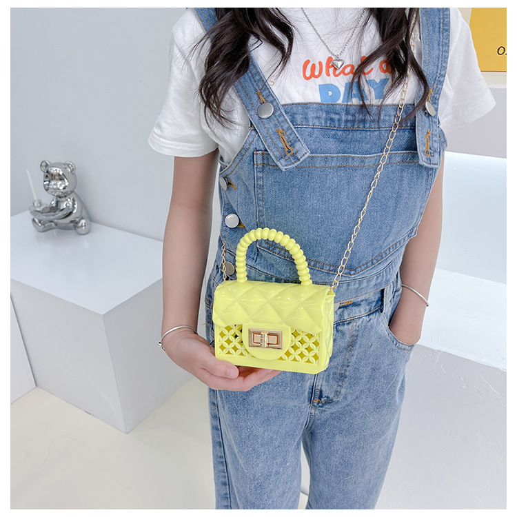 Fashion Solid Color Hollowed Children's Jelly Messenger Bag 12*9*5cm display picture 1