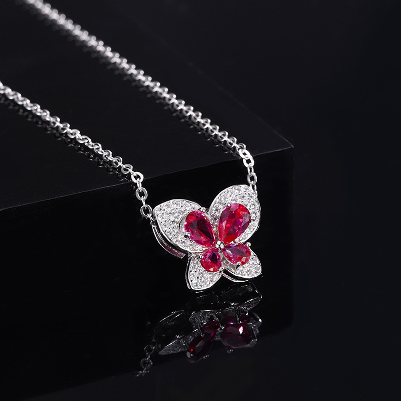 Joyas Zhuang Shengsheng, fondo de cobre, versión coreana chapada en oro, colgante de collar de lazo de corindón rojo de simulación de línea de moda ins