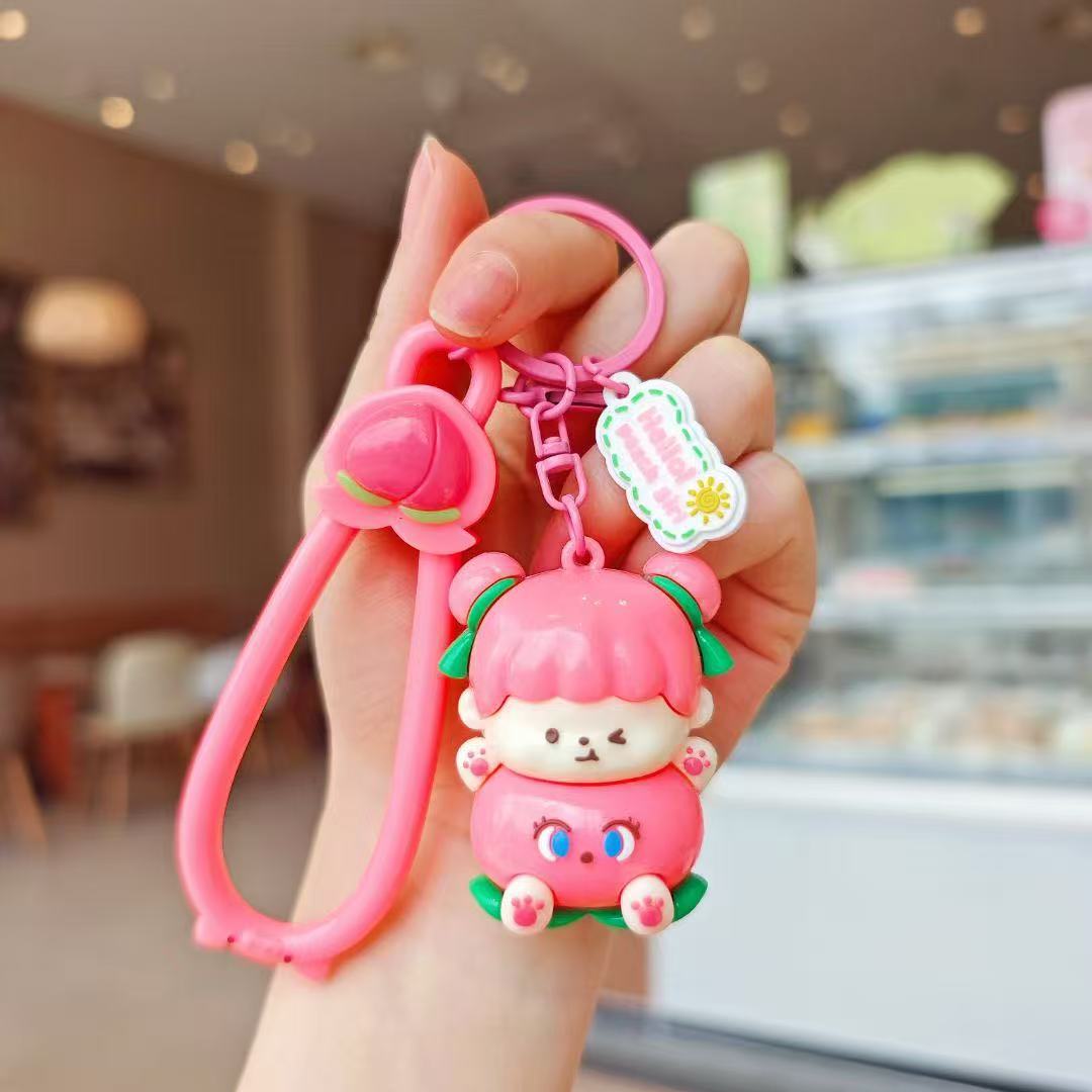 Llavero de melocotón lindo original Peach Yunlian muñeca de dibujos animados colgante pequeño llavero de coche mochila colgante de bolsa
