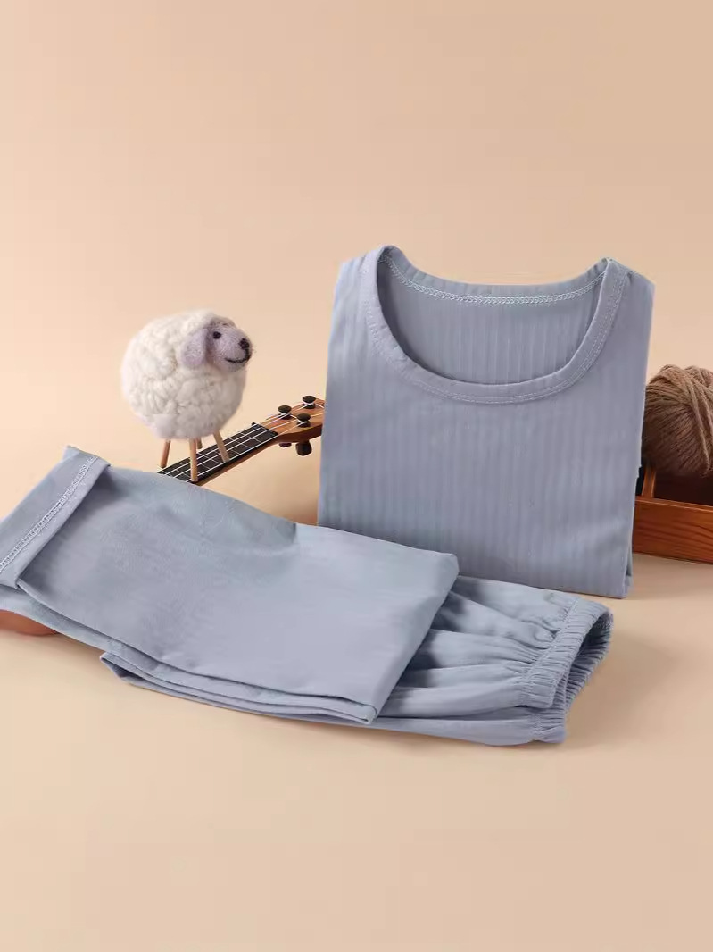 Nueva ropa infantil para el hogar sin huesos pijamas de manga larga primavera y otoño ropa de aire acondicionado de niñas algodón hombre