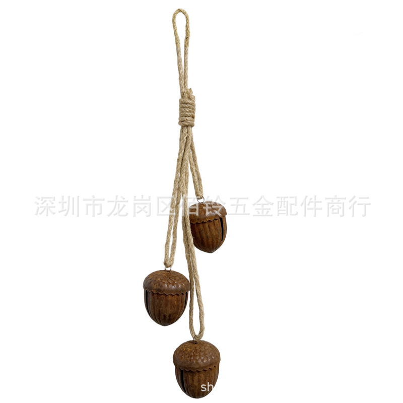 A String of Vintage Metal Bells in a Distressed Rust Color, Large Pinecone-Shaped Jingle Bells with Twine, Handmade DIY Holiday Decorations