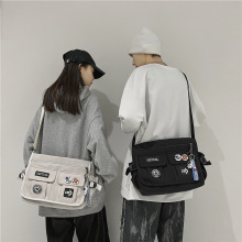 新款斜挎包男士潮牌日系工装挎包帆布学生邮差包女背包休闲单肩包