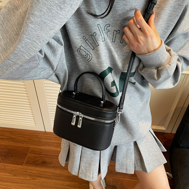 Bolso de cubo popular de este año 2025 verano nuevo bolso de hombro con patrón de lichi bolso de mensajero simple y versátil mujer