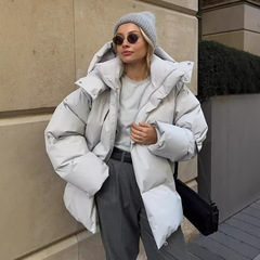 国境を越えた綿服のコート女性2025年冬欧米の新型綿入れのゆるい綿服のジャケットの純色の帽子の綿服