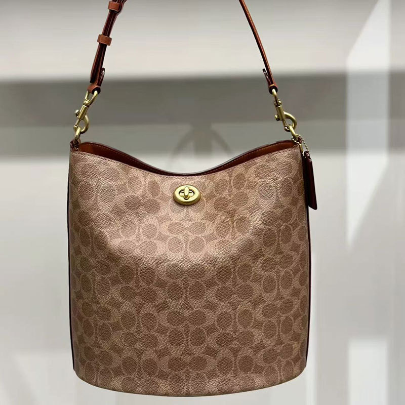 Qadın çantası — monogram naxışlı çevrilən bucket model