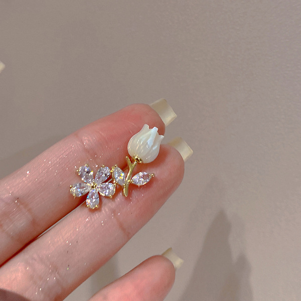 Elegant small design asymmetrical earrings with zircon