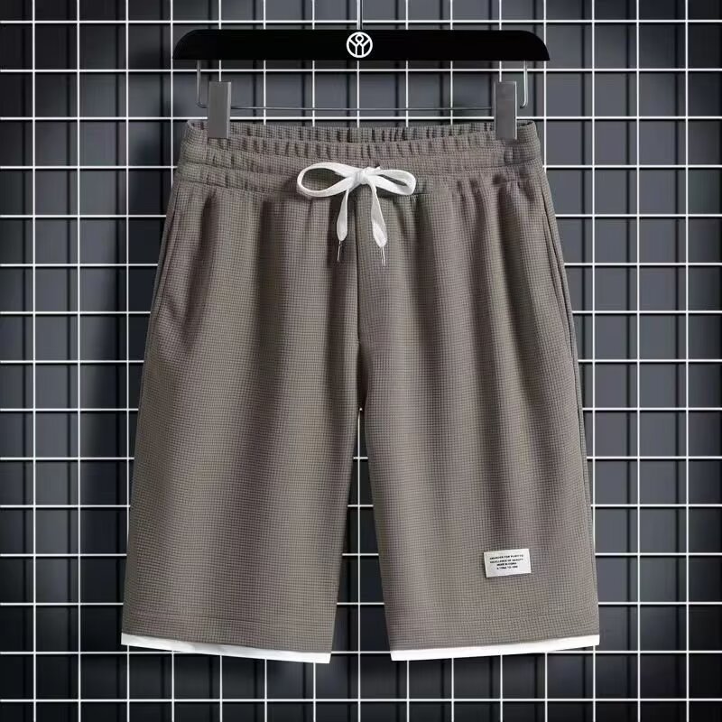 Camisa menos ropa Waffle pantalones de cinco puntos para hombres verano nuevo estilo estilo Hong Kong pantalones cortos de dos piezas falsos de color recto suelto