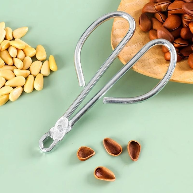 Pine nut shell opener