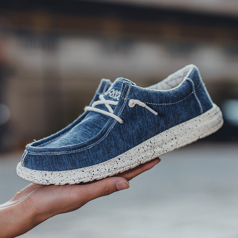 2025 al por mayor de primavera de mediana edad nuevos zapatos casuales de hombre zapatos de tela transpirables zapatos de lona PU ligeros zapatos de pedaleos