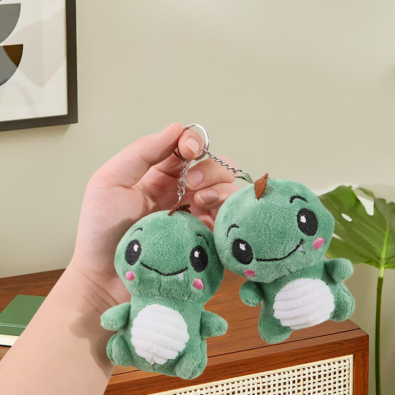 Lindo rubor pequeño sentado dinosaurio llavero de felpa bolso escolar colgante colgante máquina de garras muñeca muñeca regalo