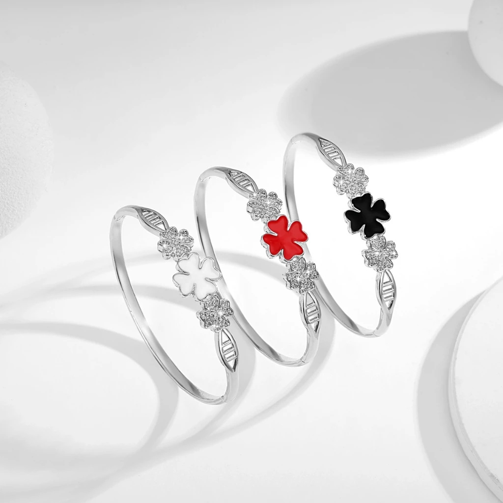 Joyas explosivas transfronterizas, brazalete abierto de trébol de cuatro hojas chapado en oro, sentido de diseño, pulsera de trébol de cuatro hojas con incrustaciones de circón, joyería para mujer