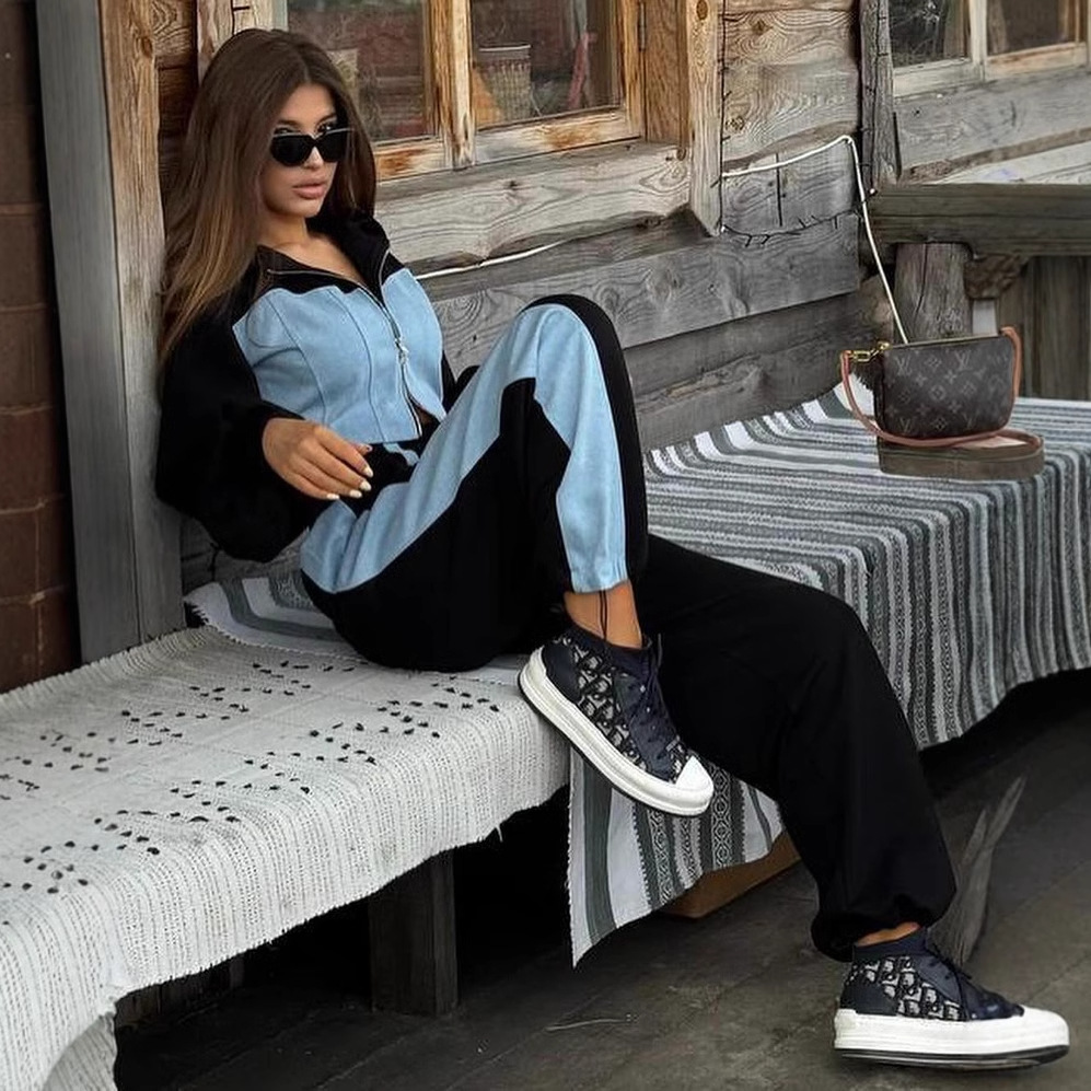 D9727 venta caliente suéter de moda casual de mujer europea y americana costura de mezclilla con capucha top pantalones de dos piezas