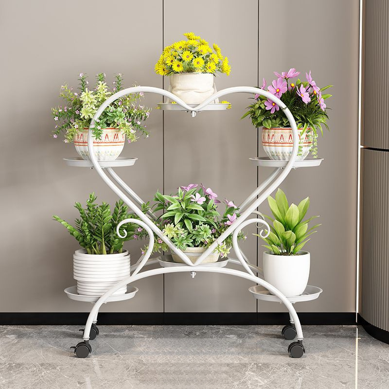 El fabricante del marco de flores de hierro nórdico aterrizó en la Sala de estar de Luoluo verde de varios pisos, con ruedas móviles en el interior del estante de plantas domésticas.