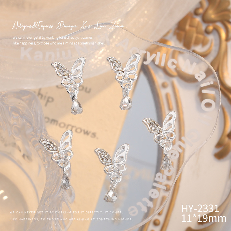 Nueva joyería de aleación de manicura completa diamante borla arco corona plata uñas manicura joyería accesorios al por mayor