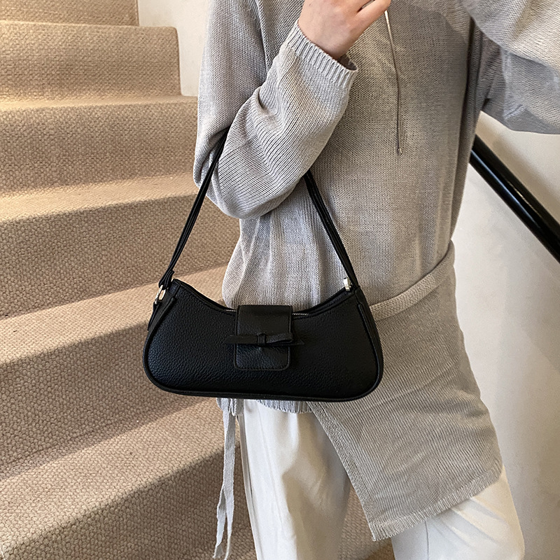 Versión coreana del bolso de axila de nicho 2025 primavera y verano nuevo bolso femenino lindo bolso de lazo bolso de hombro diario