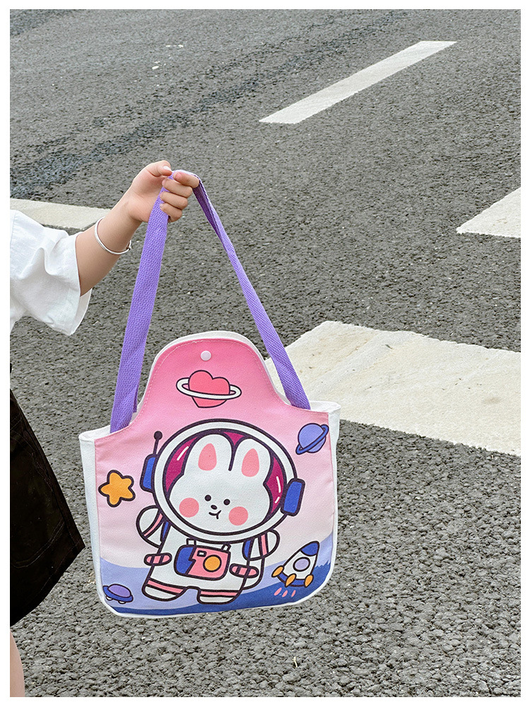 Wholesale cartoon canvas bags, female student tutorial bags, Japanese-style illustration large-capacity single-shoulder bags, cute hand-carry bags Application Scenario