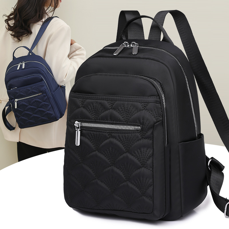 2024 nueva mochila de nylon bordada casual para mujer simple y ligera mochila de viaje de viaje urbano mochila escolar de moda
