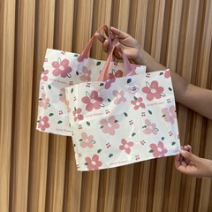 卸売りの新しいプラスチックの手提げ包装の贈り物の服の店の婦人服の子供服の買い物袋の子供服の靴の箱の袋