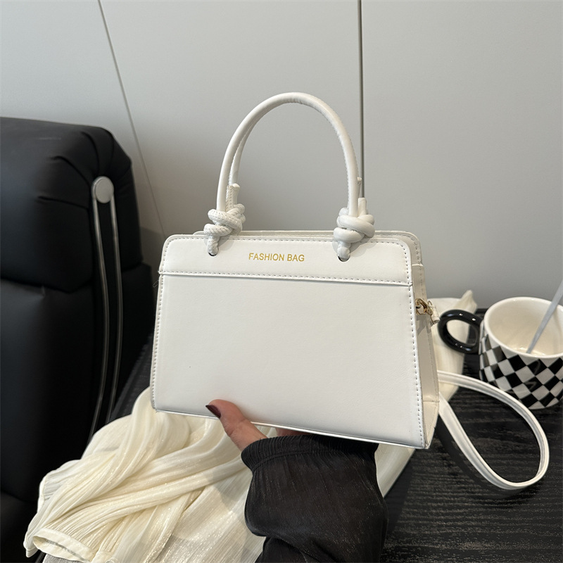 Bolso de mano damas 2025 nueva primavera y verano textura superior nicho de gran capacidad retro bolso de mano tote
