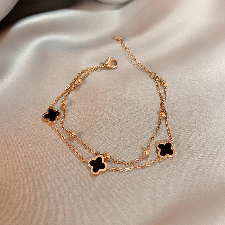 Korean version of simple four-leaf clover bracelet women's fashion double chain titanium steel 18K rose gold sweet temperament jewelry wholesale