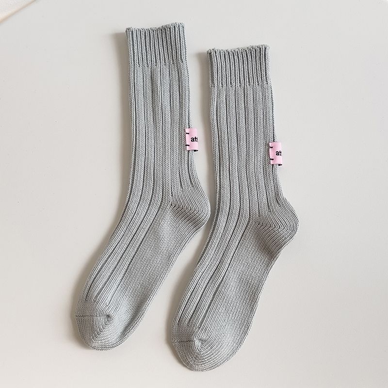 Nicho etiqueta rosa japonés retro color puro algodón crudo embrión línea gruesa media pantorrilla calcetines Otoño e Invierno hombres y mujeres calcetines largos de pila ins