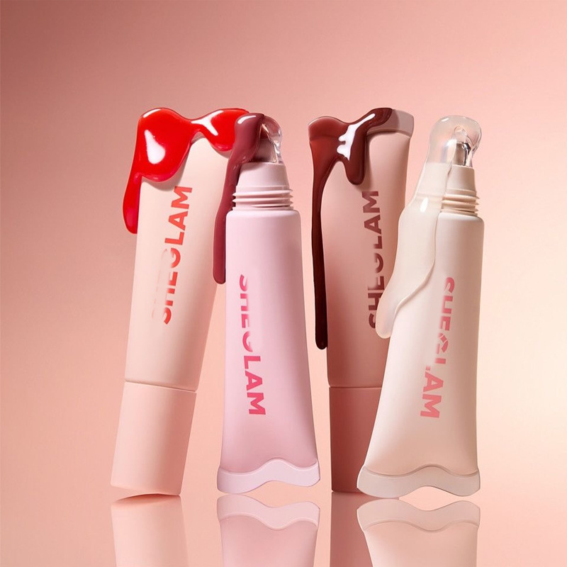 Sheglam dodaq parıltısı və dodaq yağı
