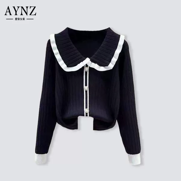 Black doll, sweater, doll collar