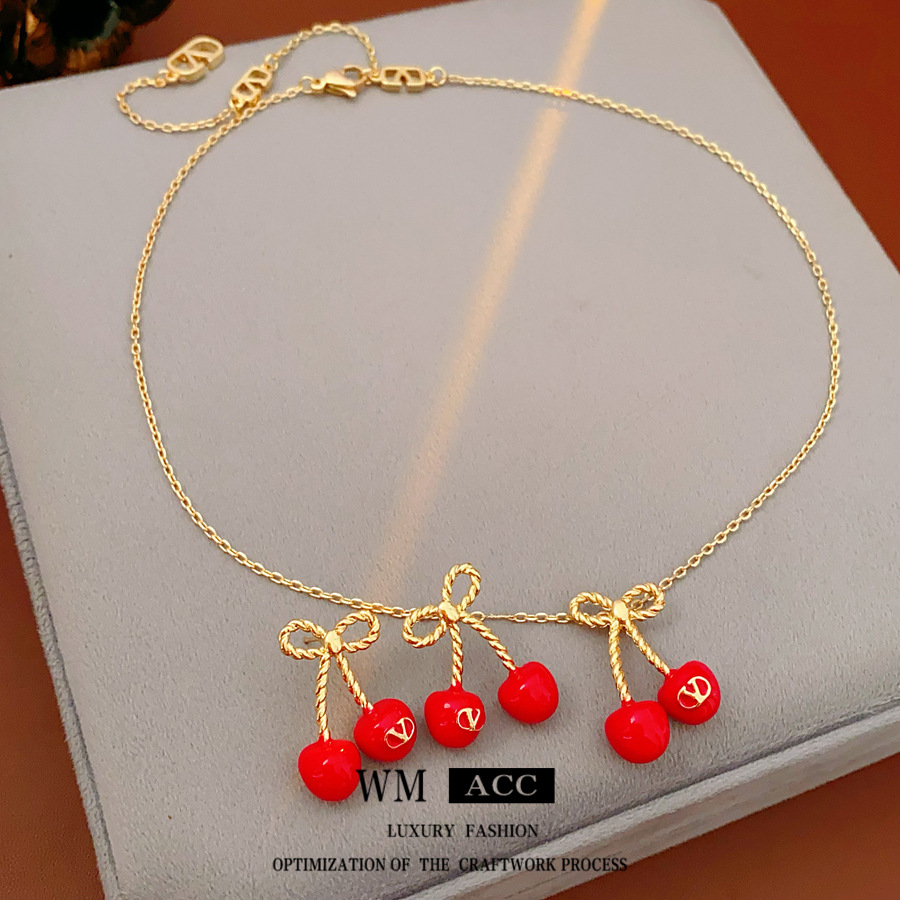 Aguja de plata, arco, letras de cereza, pendientes, collares frescos y dulces, cadenas de clavícula, temperamento de nicho, joyería femenina, sentido superior.