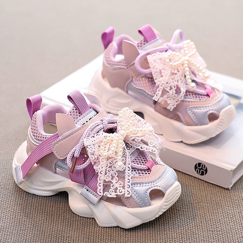 Sandálias de niñas 2026 verano nuevo niño red zapatos deportivos de cabeza de pan niña princesa con suela suave zapatos de red