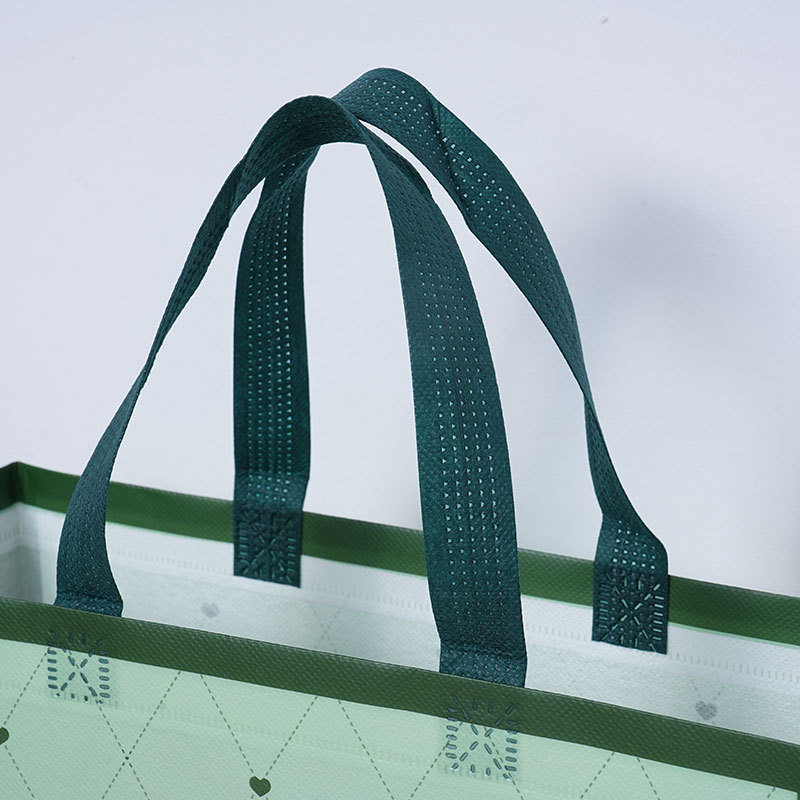 Bolsas de tela no tejida cubiertas de amor verde personalizadas atmósfera simple de alto valor de color bolsas de hombres y mujeres clásicas impermeables engrosadas