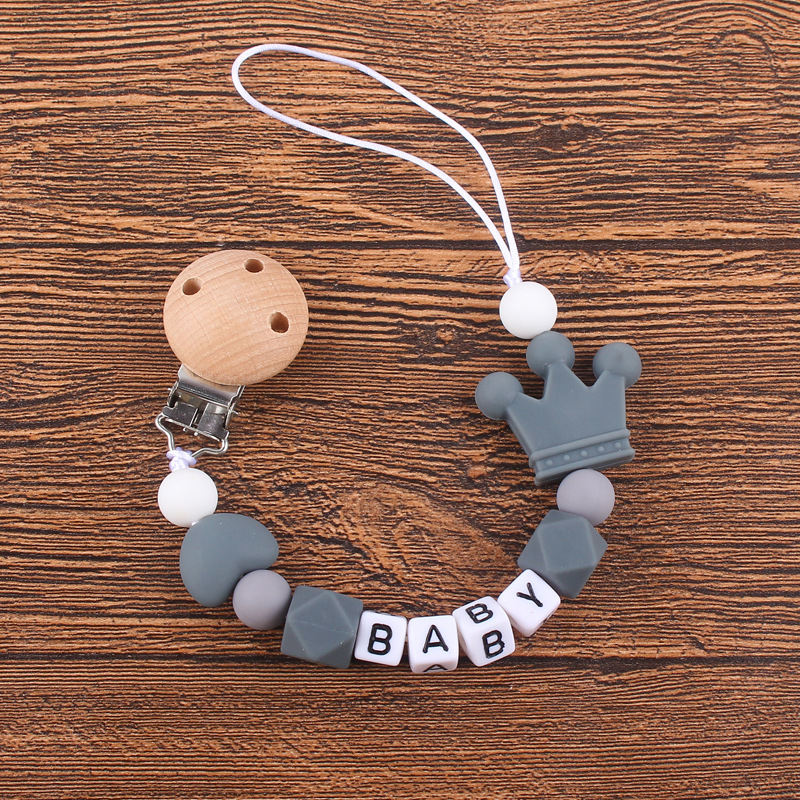 Nuevo bebé haya chupete clip calmante bebé corazón corona de silicona mordedura molar Cadena de chupete cadena anti-caída