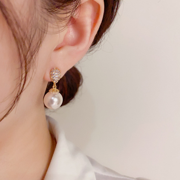 Sophisticated small fashionable elegant earrings drop-shaped from…