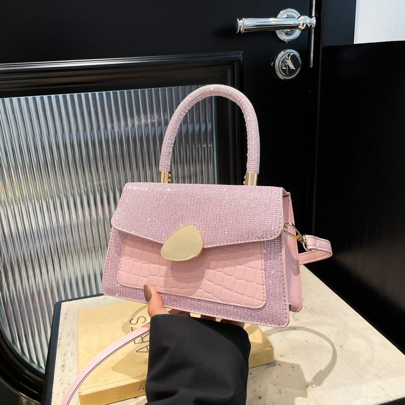 Hong Kong retro caramelo bolso de mujer 2025 moda nueva mochila de moda estilo extranjero cocodrilo empalme bolso pequeño