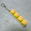 Four-button white shell - yellow silicone cat paw