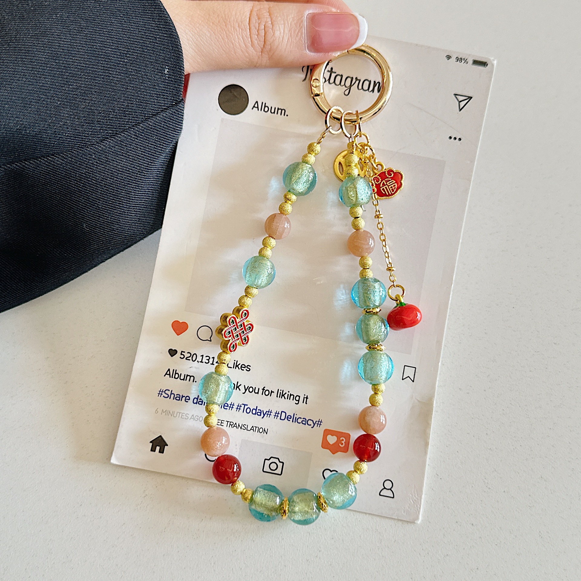 Boutique hecho a mano de alta gama cadena de teléfono móvil pulsera de caqui de vidrio de hoja de oro cordón de teléfono móvil de moda colgante de bolso corto