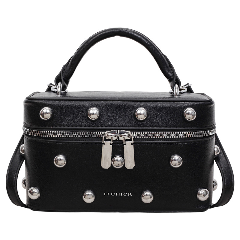 Bolsos portátiles de textura alta para mujeres 2026 nuevos nichos transfronterizos de diseño remaches de moda versátil bolso de mochila