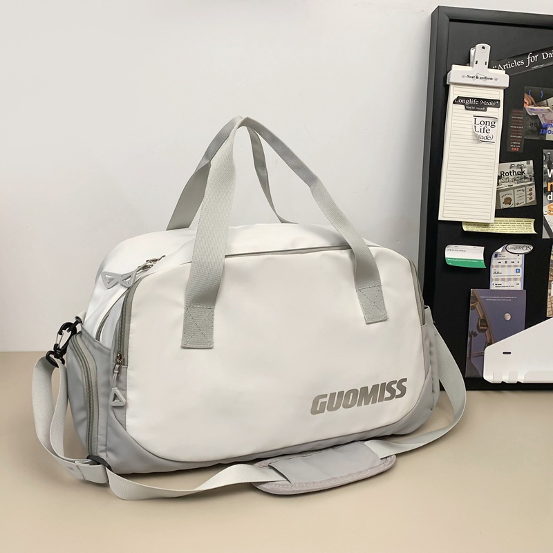 Nueva bolsa de viaje corto simple de gran capacidad de viento para hombres y mujeres bolsa de ocio deportiva bolsa de ejercicio bolsa de mochila