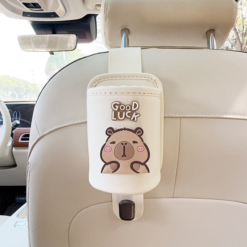 Seat Back Cup: Qìchē Car cup holder/beverage holder - beige-leather-cup-holder-with-hook-squinting-capybara