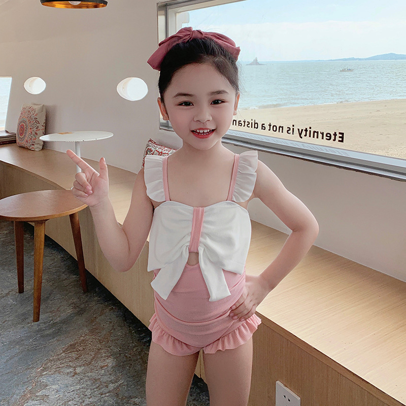 Traje de baño para niñas de una pieza estilo coreano lindo arco traje de baño para niños pequeño traje de baño de vacaciones de primavera caliente fresca al por mayor
