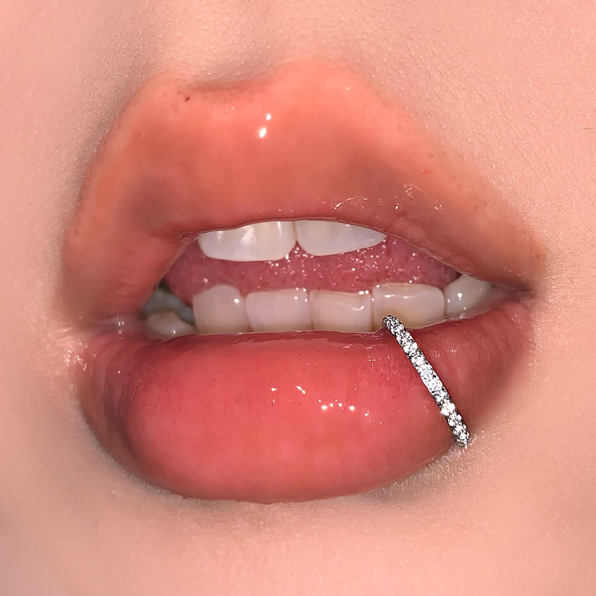 Silver pointed spike labret stud material detail