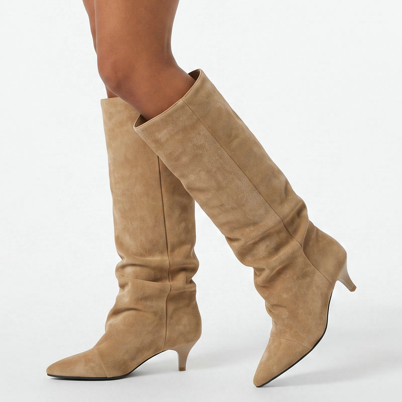 Pointed-toe, stiletto-heeled, long boots for women, featuring a suede finish, pleated design, a loose fit, and a length that doesn’t go above the knee; also known as cat-heel long boots or riding boots Pointed-toe, stiletto-heeled, long boots for women, featuring a suede finish, pleated design, a loose fit, and a length that doesn’t go above the knee; also known as cat-heel long boots or riding boots