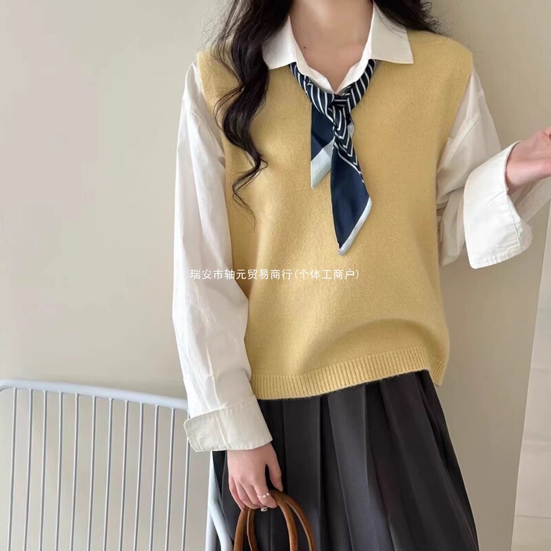 Stylish knitted vest with a V-neck and tie detail, perfect for layering in early autumn, offering a versatile and elegant look