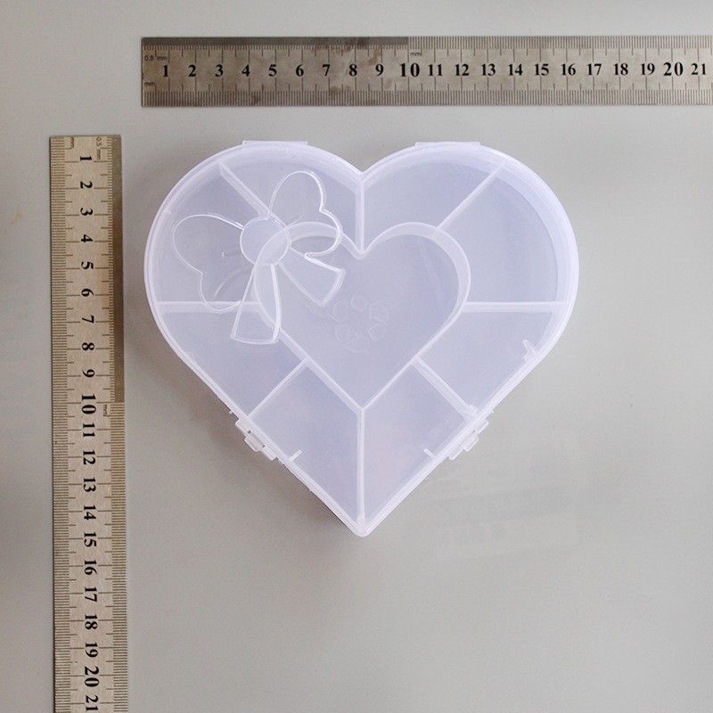 Directo de fábrica PP material amor arco multi-rejilla caja de almacenamiento transparente joyería accesorios para el cabello niños regalo de plástico