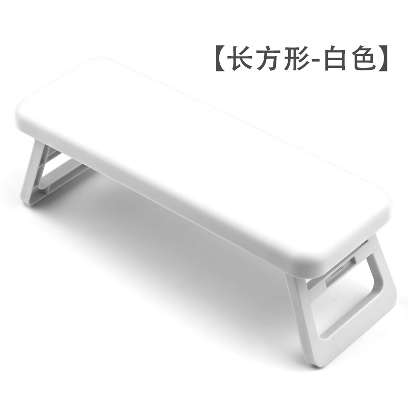 Transfronterizos manicuría almohada plegable y alta luz manicuría almohada de mano de plástico manicuría tienda de manicuras muñeca soporte almohada al por mayor